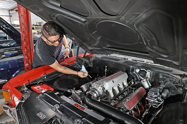 Maintentance - Mechanic checking the oil
